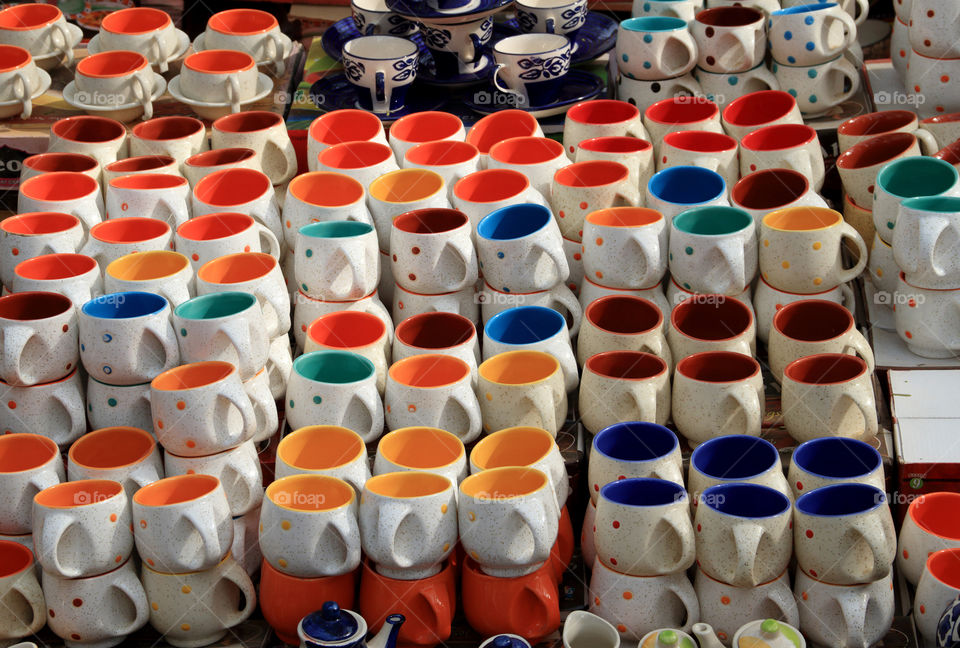 Lot of colorful ceramic mugs cups