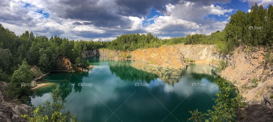 And old quarry in Uskavi, Sweden that is now filled with clear water. A popular place to take a swim. 
