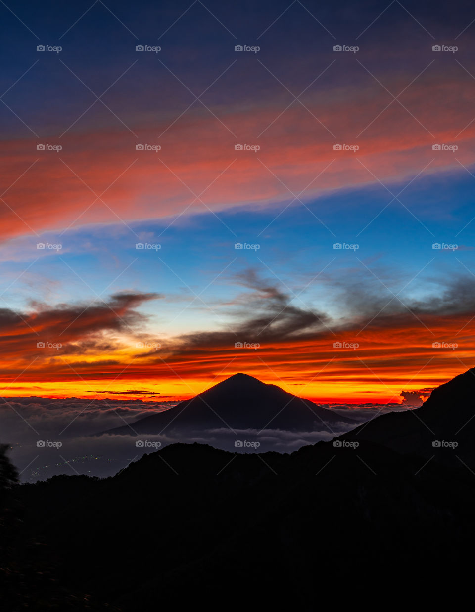 Orange in the sky, indicating that the morning sun will soon appear. The natural beauty of one of Indonesia's mountains