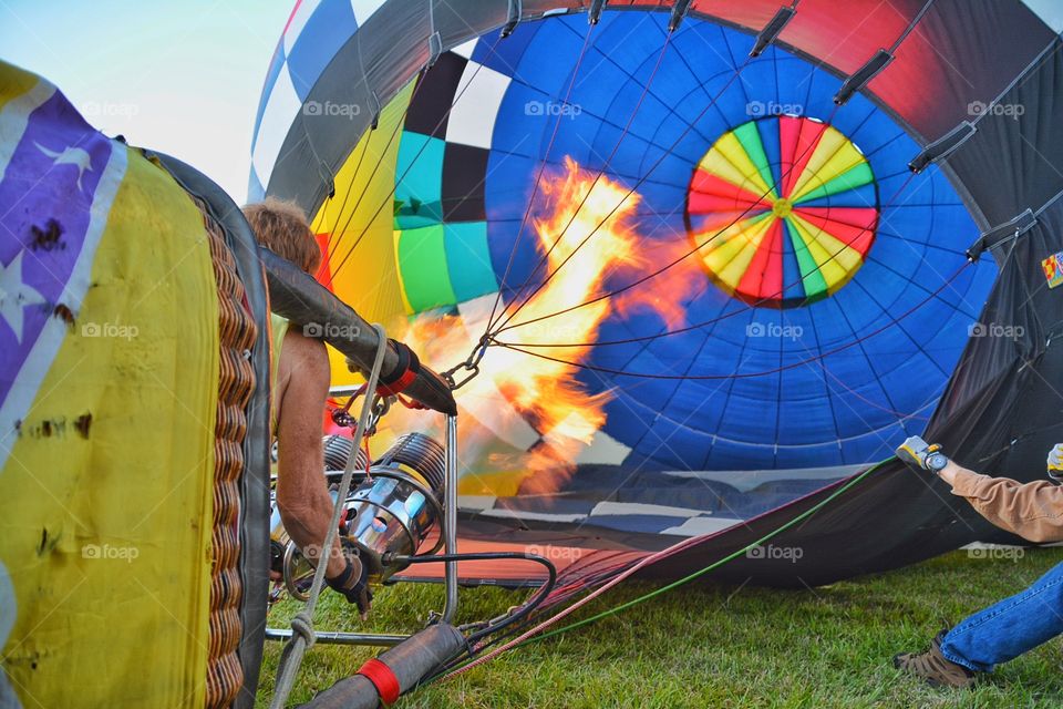 People getting ready a hot air balloon