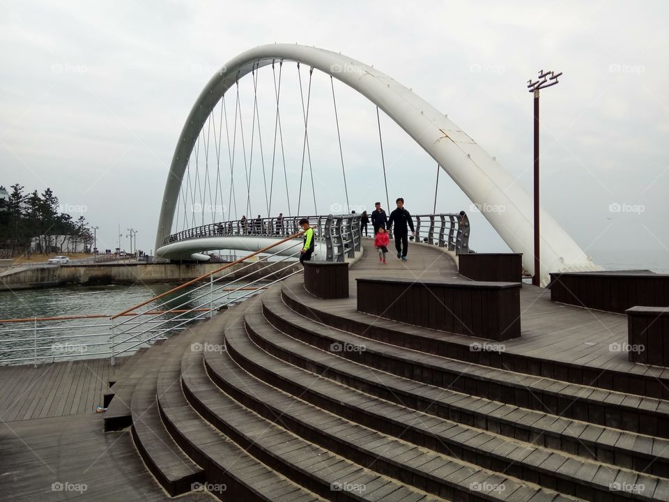 People strolling on the bridge