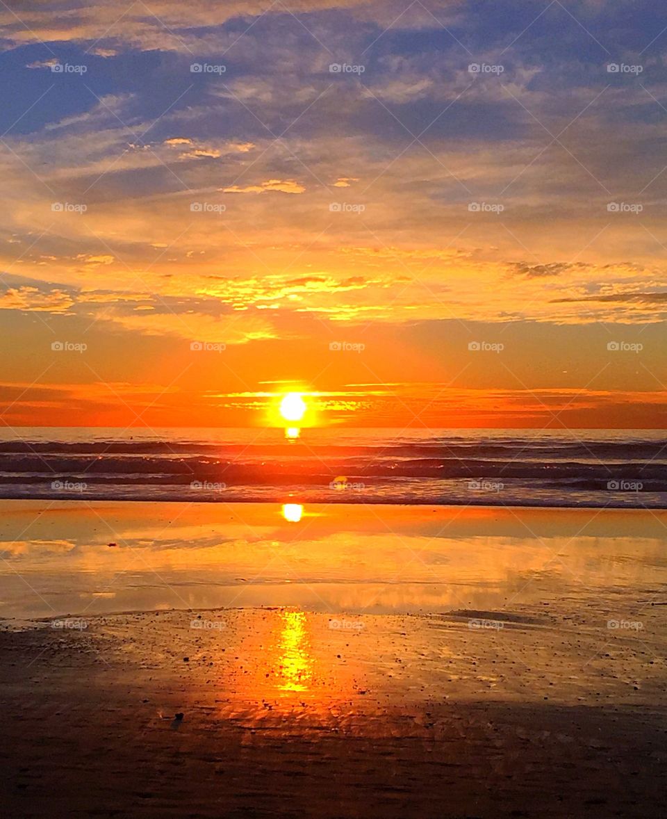 View of beach at sunset