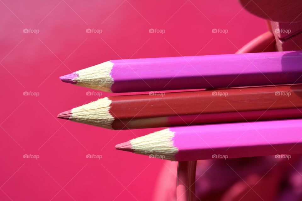 pink color wooden pencils pink background