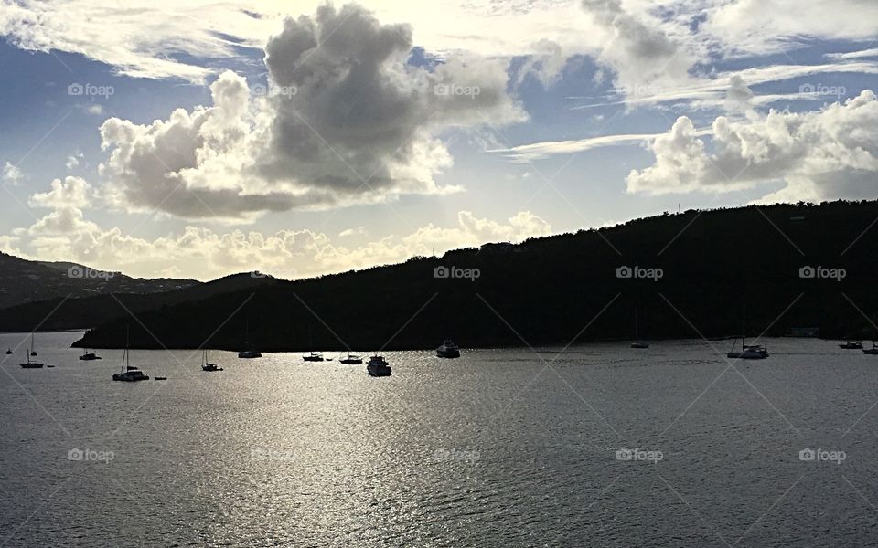 Looking out over the bay in St. Thomas. Puffy white clouds, blue skies, calm harbor and warm temps greet us. 