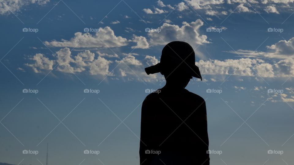 Silhouette of Boy in a Hat