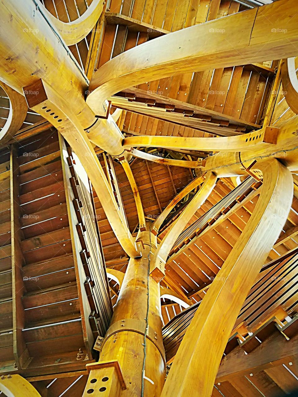 wooden triangle structure with stairs taken from underneath