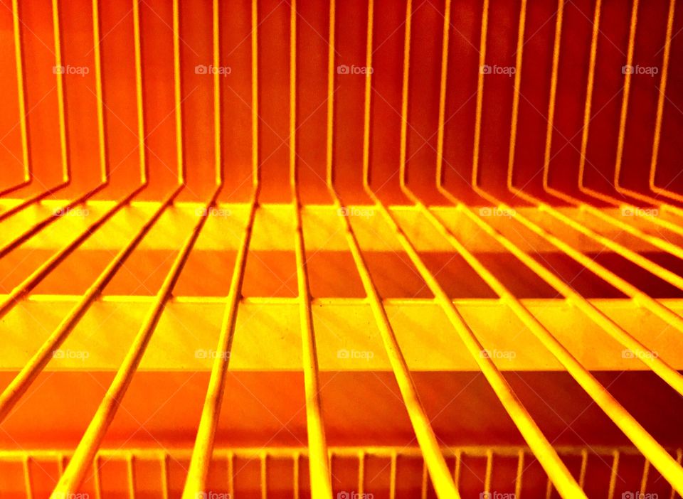 Empty yellow shelf in toy store.