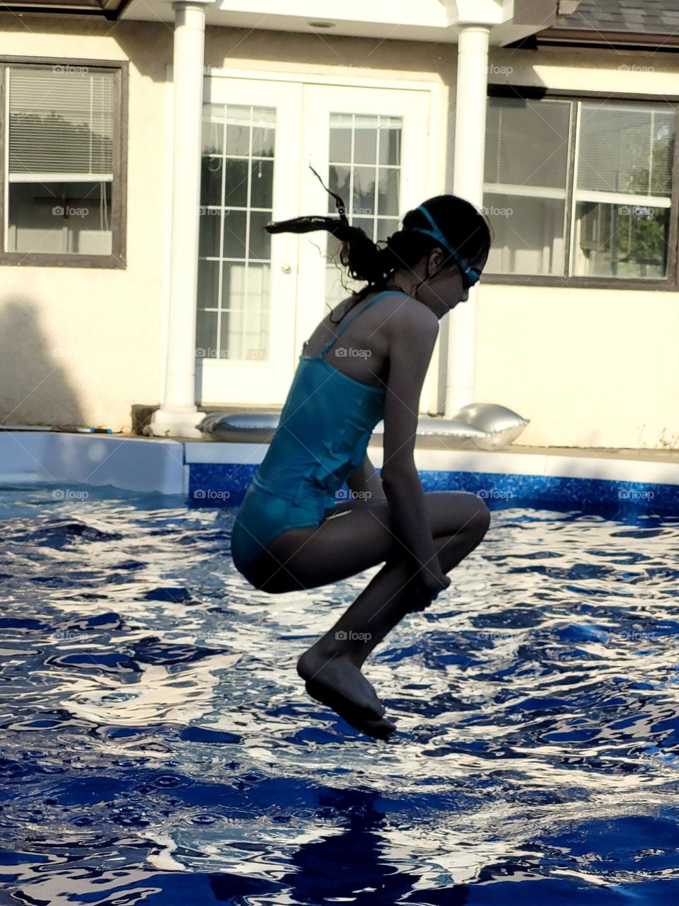 jumping into the pool