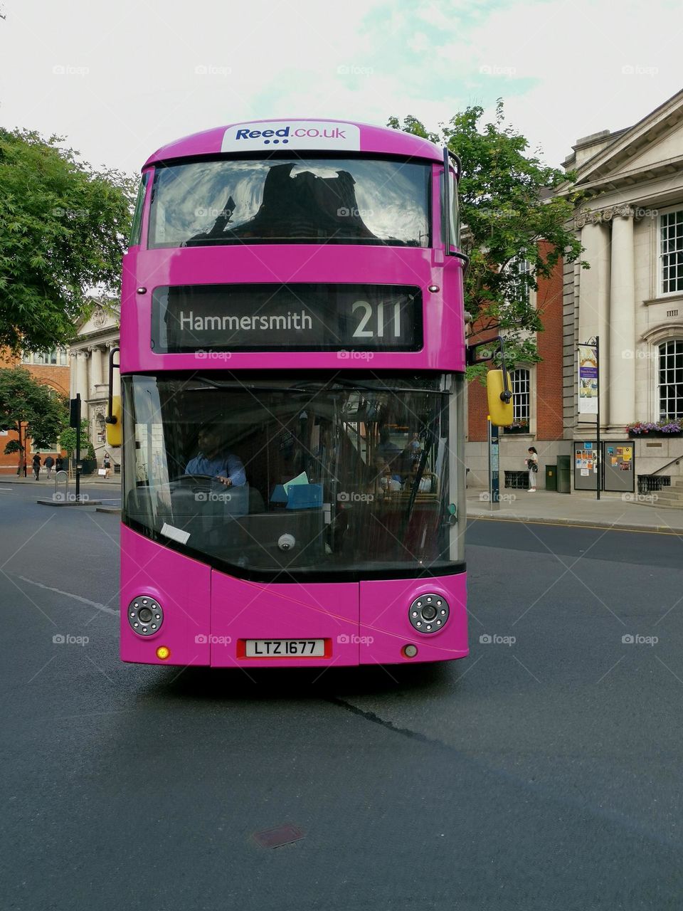 Car with soul. Pink bus. London streets.