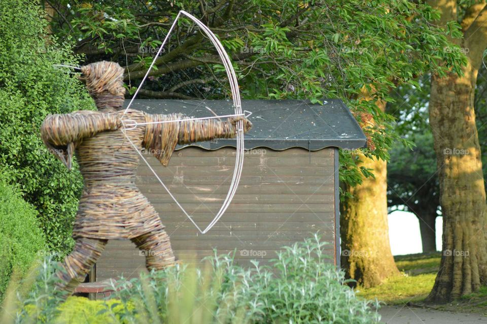 Wicker scalpture of Robin Hood in the gardens of the castle in Nottingham , England, UK