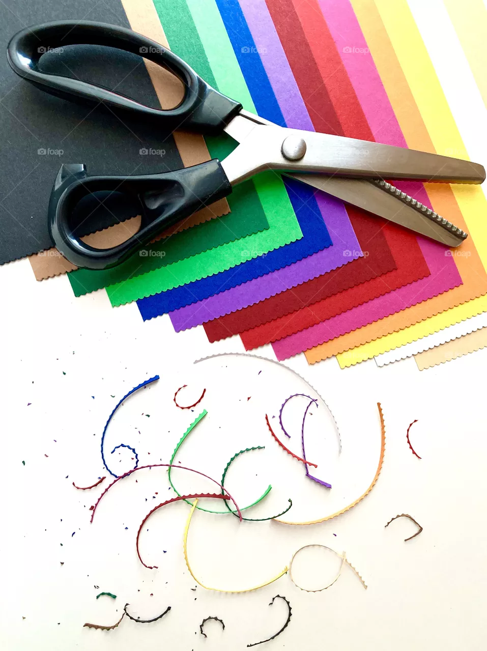 Curly scissors and curly edge of paper