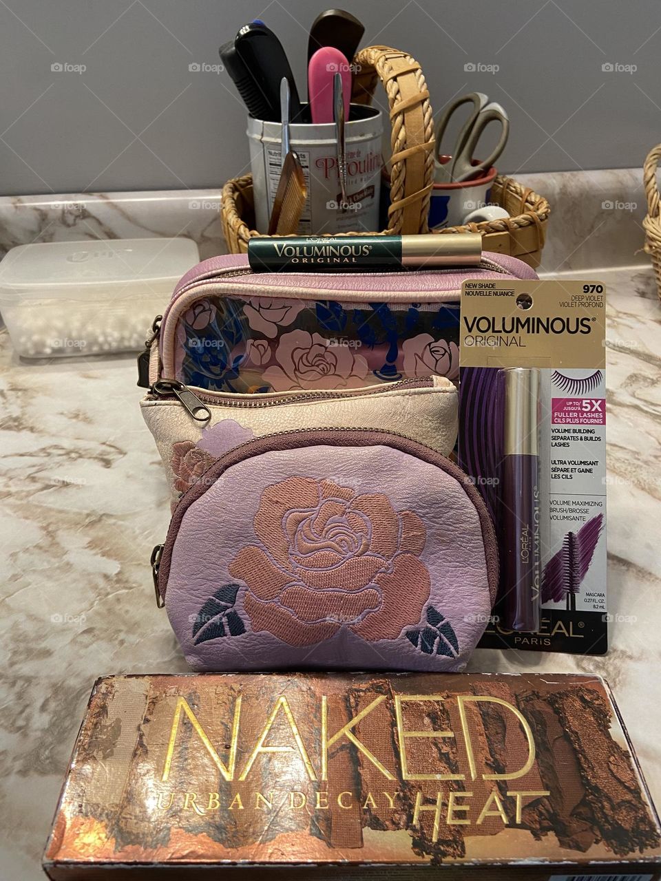 My current makeup collection: Naked Heat Urban Decay eye shadow palette , L’Oréal Voluminous Mascara in Deep Green (a favorite) and Deep Violet (can’t wait to try it) and Beauty and the Beast-themed cosmetic bags from Box Lunch. 