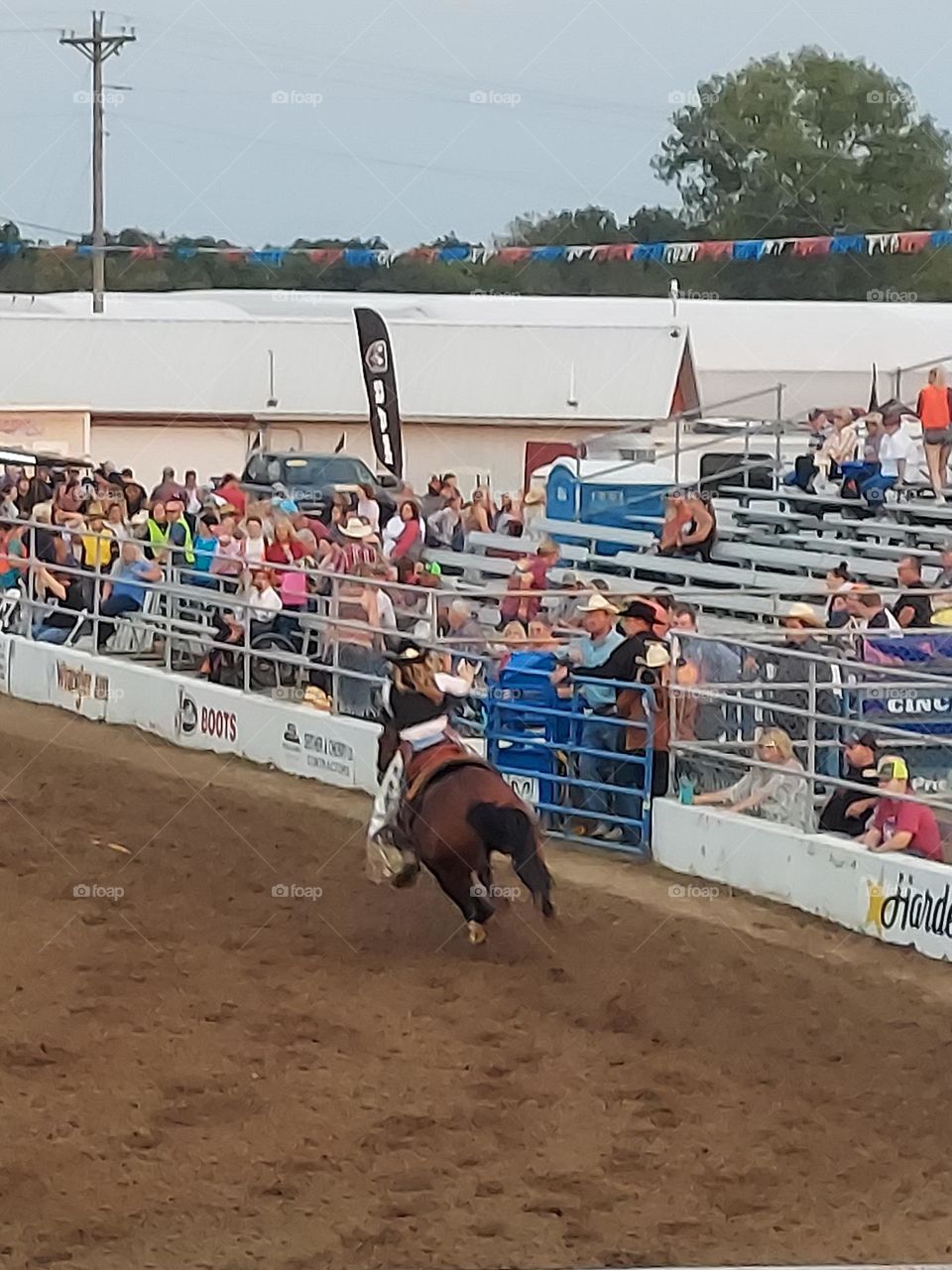 Riding a house in a rodeo