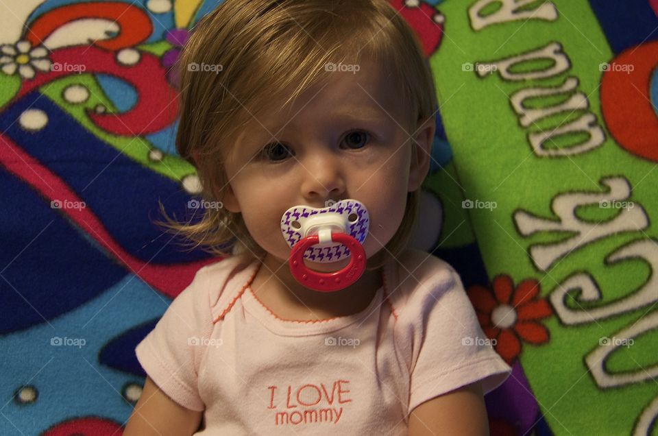 Baby with binky. Baby girl with her binky