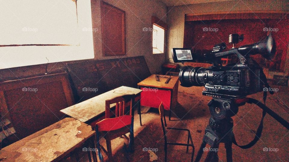 A sequence of photographs of a TV camera that records a report on the past of Yugoslavia