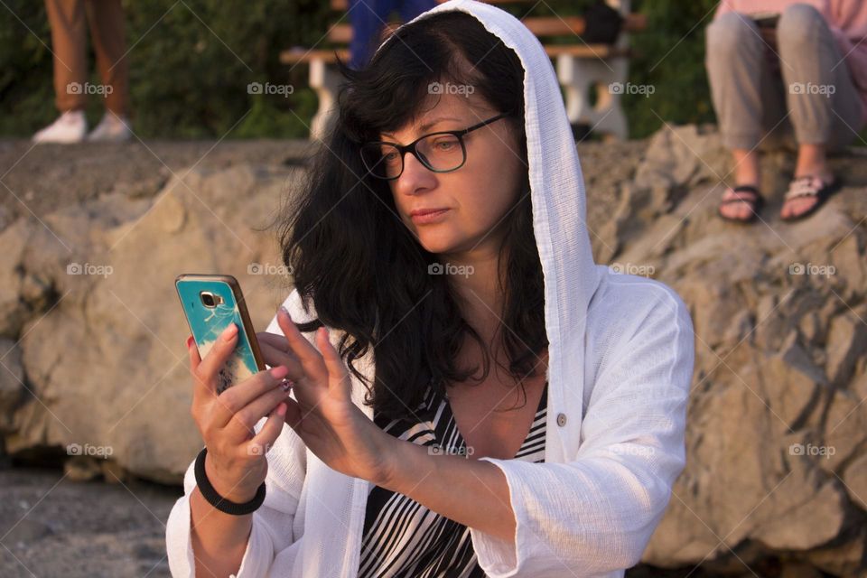 A woman using mobile phone outdoor