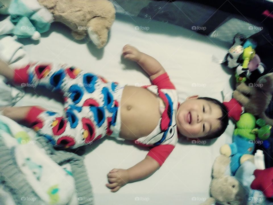 Happy Baby boy in pajamas