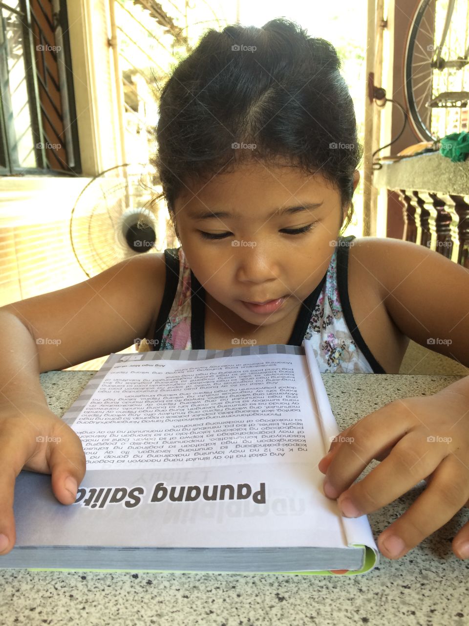 Girl reading text book