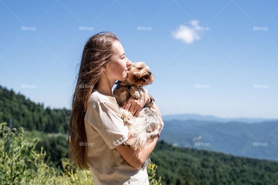 woman and dog in mountain