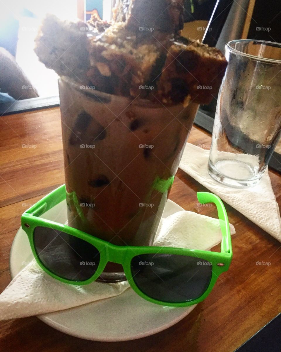 caramel coffee with datil cake and random sunglasses