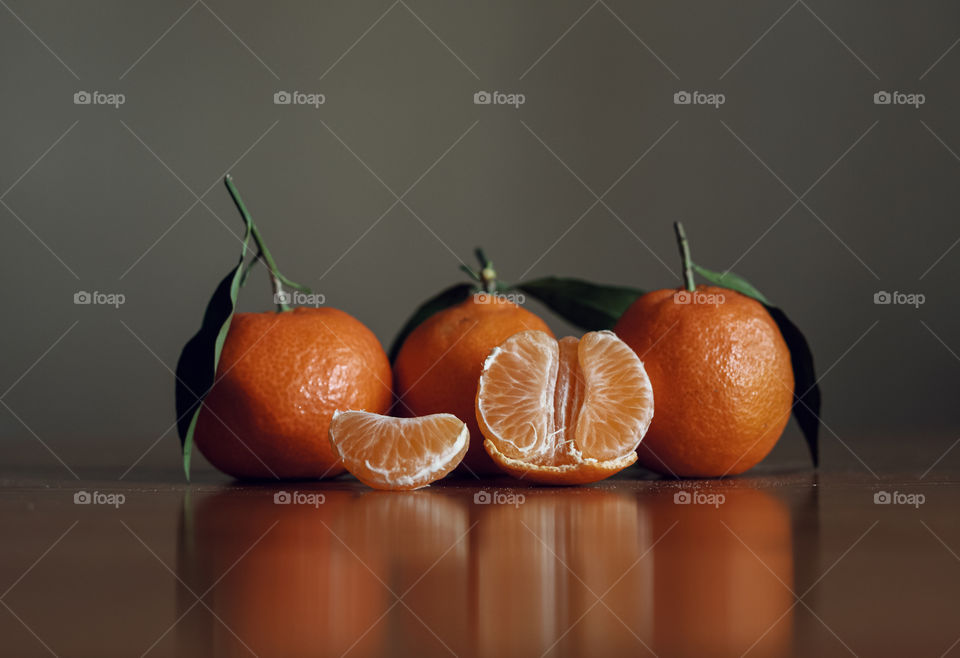 Close-up of tangerine fruits on table
