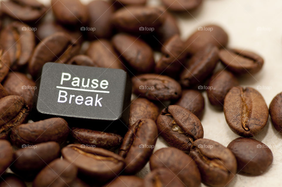 Coffee break. Let board let pause break on coffee beans close up