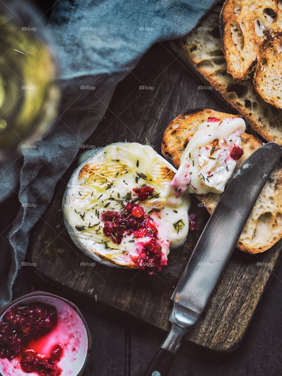 Baked camambert cheese with cranberry sauce.