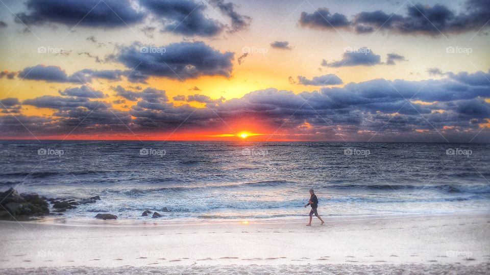 Lady walking on the beach