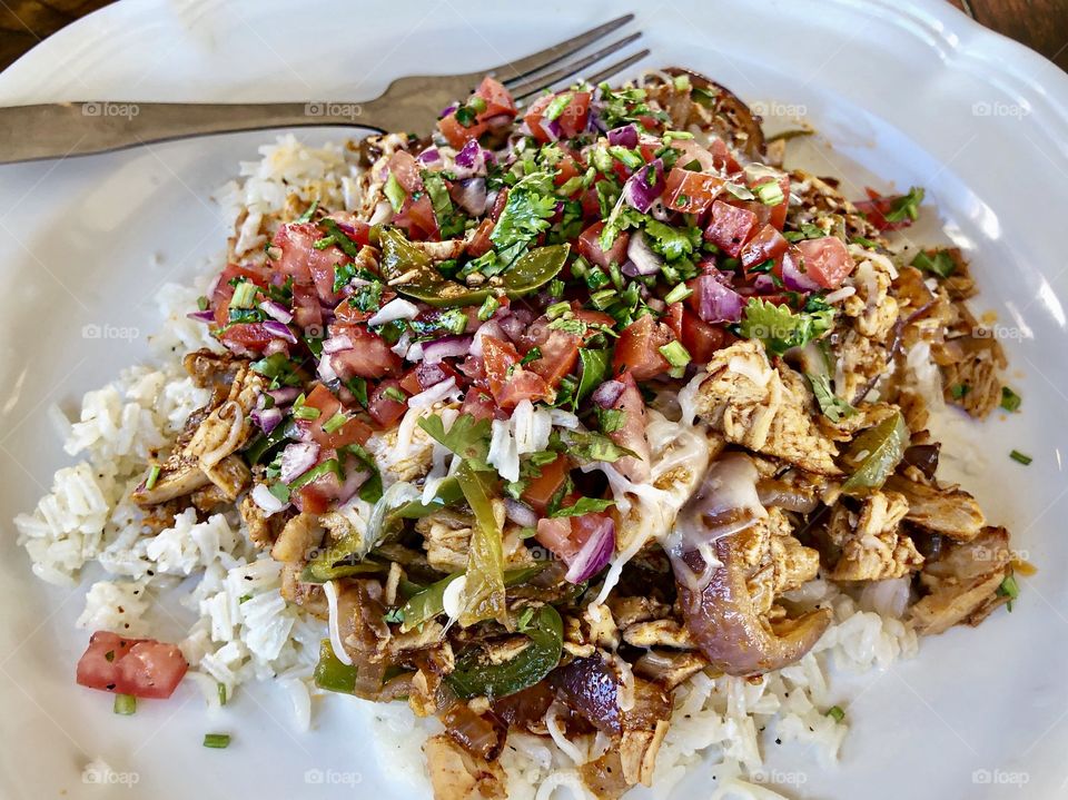 Pulled chicken with homemade salsa and rice.