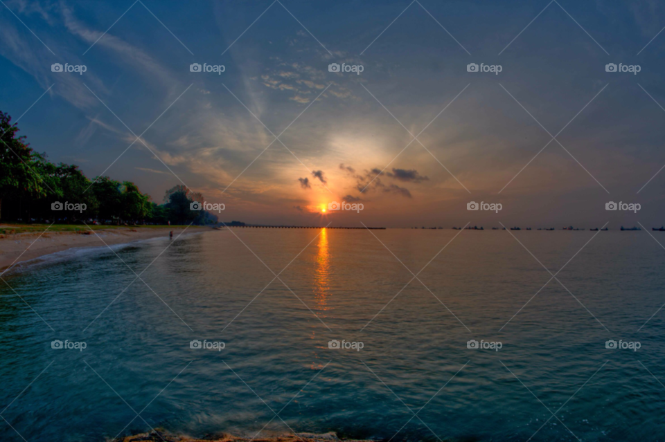 beach singapore sunrise sea by paulcowell