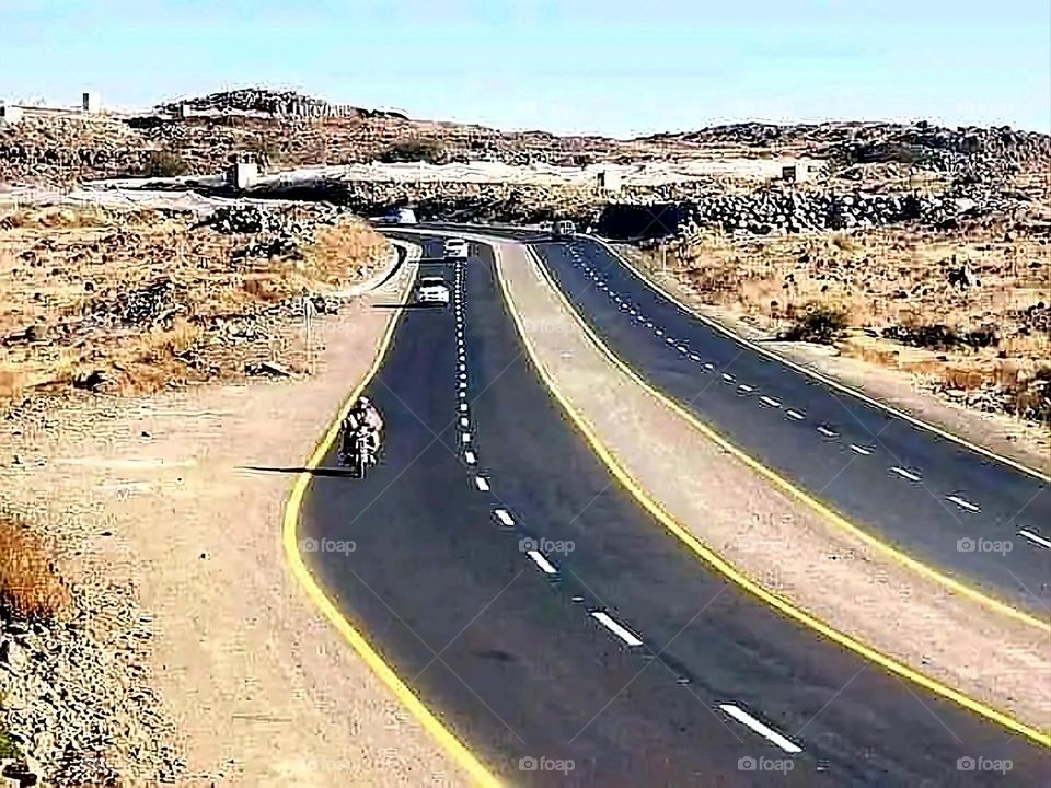 A stunning view of green mountains covered in fog in Yemen