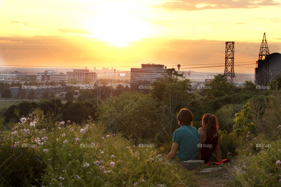 Young couple is watching a sunset