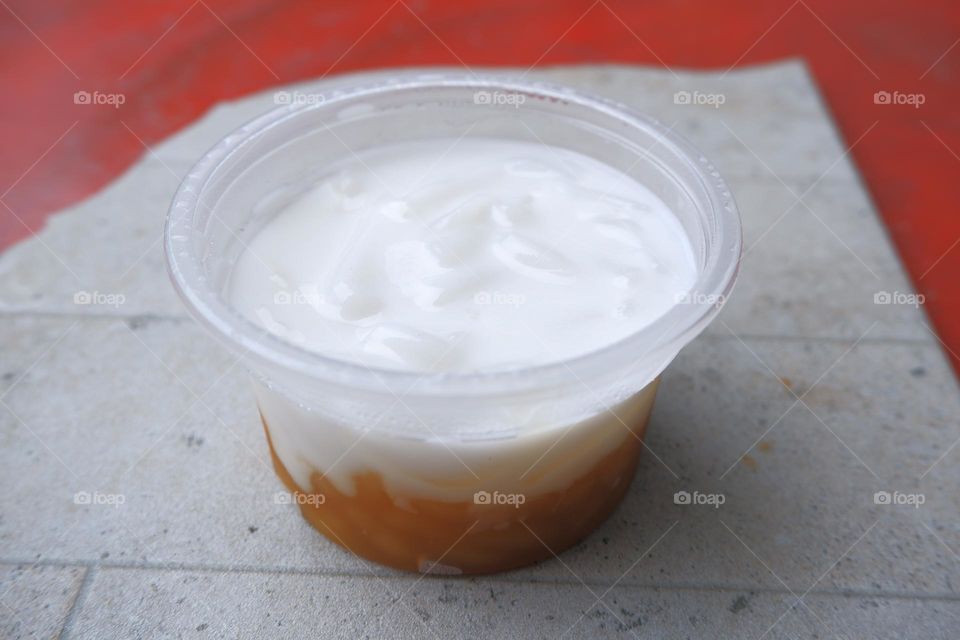 Thai pudding with coconut topping , in a cup