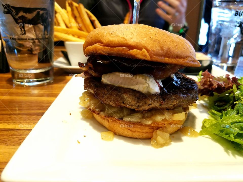 Burger with blueberry chipotle barbeque sauce and brie