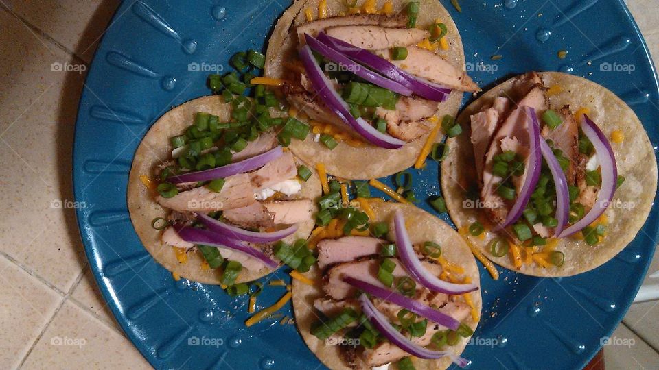 Red and green onion chicken tacos. Enjoying cooking a healthy meal
