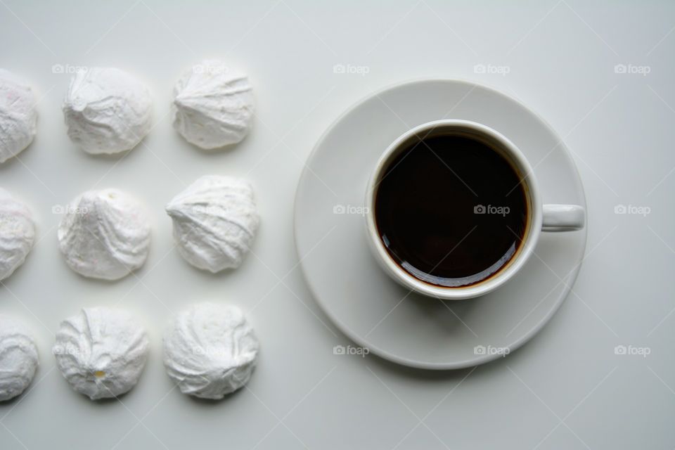 coffee cup with candy top view on a white background