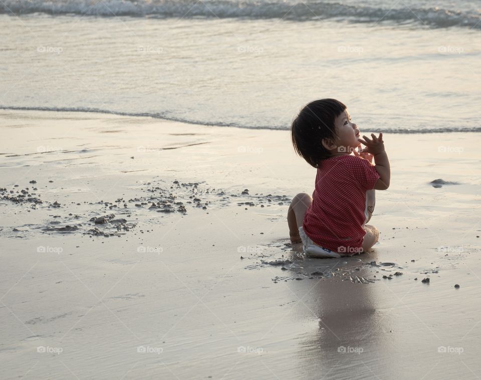 Her first step on the summer beach