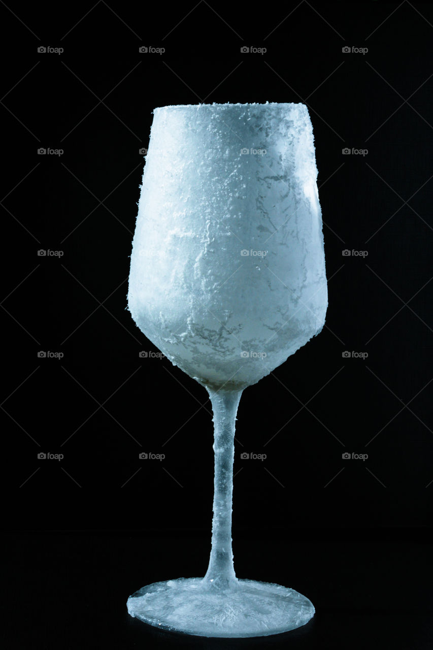 Frozen glass of white wine 