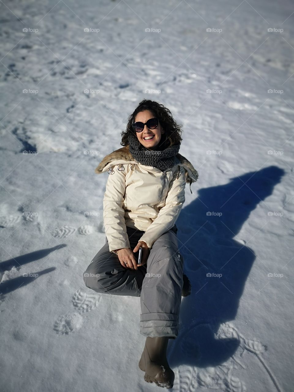 happy and smiling woman in the snow