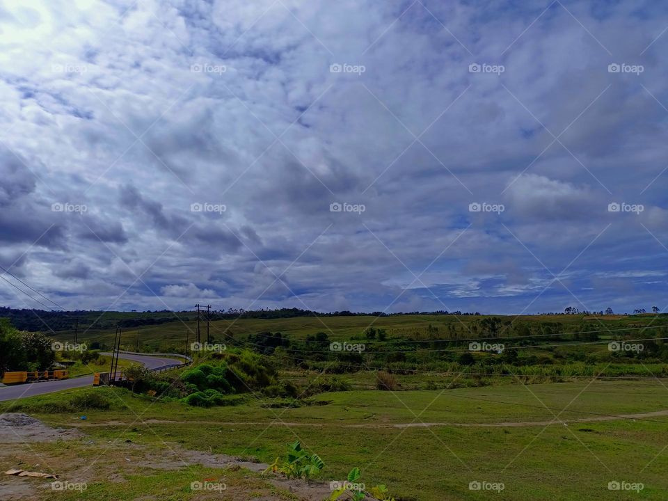 Panorama of Meadows, ravines, thickets, open deciduous or mixed forest with clearly sky at the day on Tele, North Sumatra, Indonesia