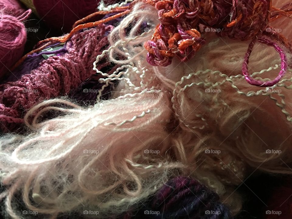 Many colors and textures of craft yarn