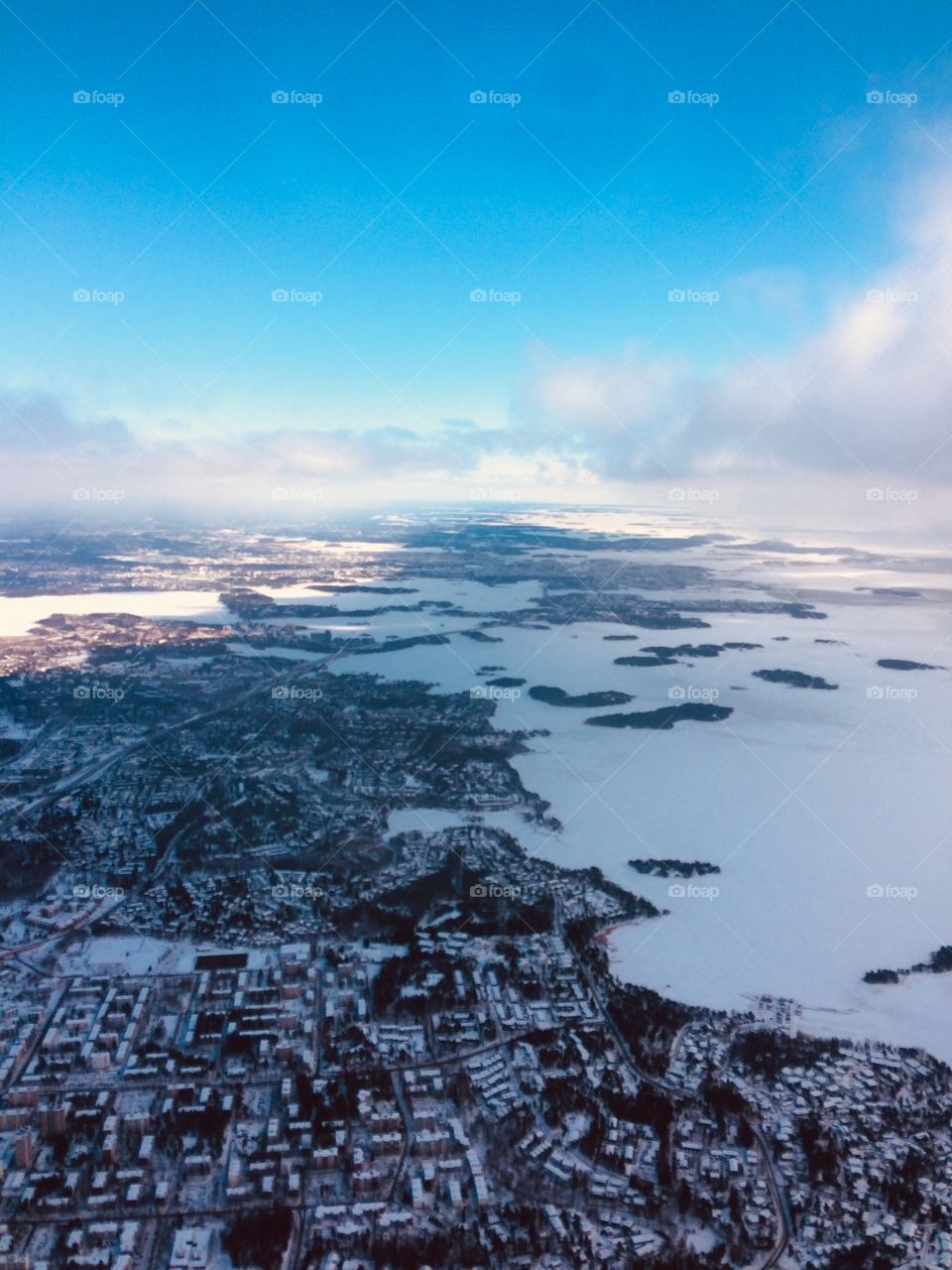 A view to the Finnish archipelago from an airplane on a sunny winter day