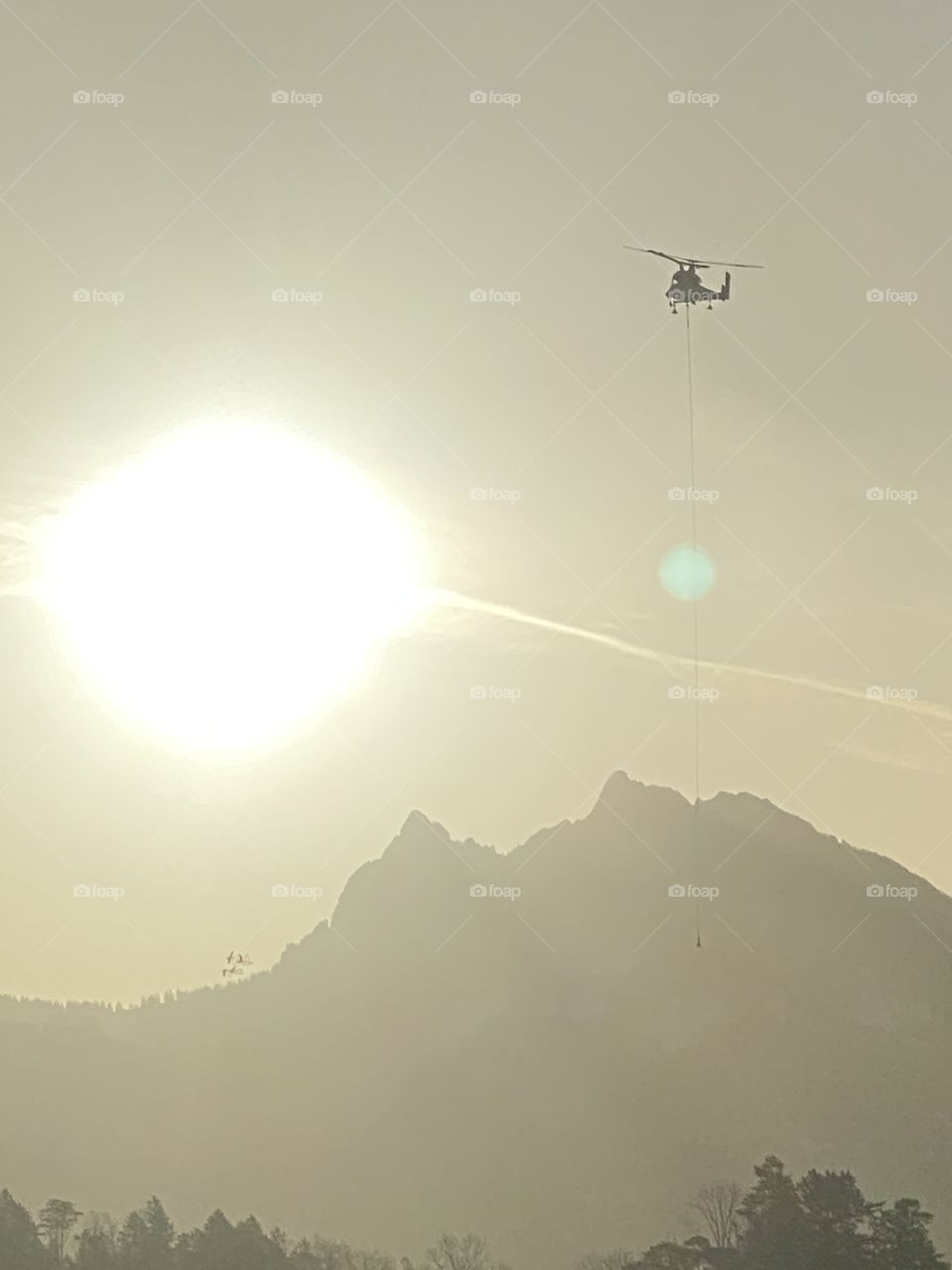 helicopter in flight to the sun