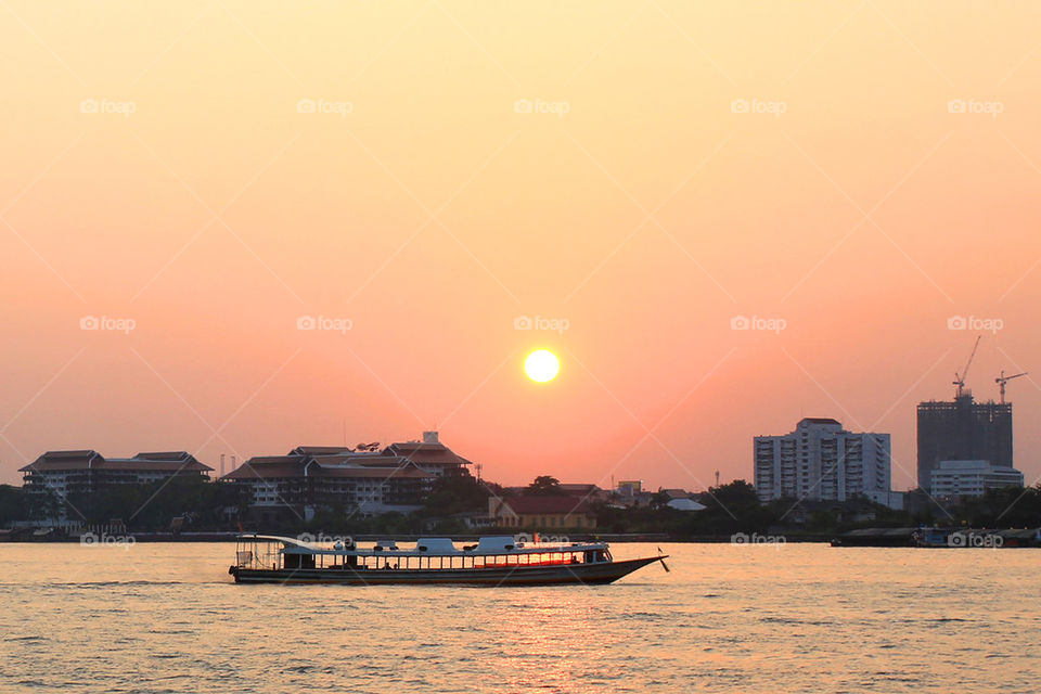 Sunset at Chao Phraya River ,Bangkok ,Thailand.