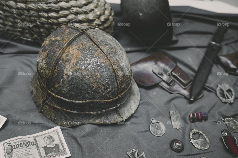 Old Germany helmet and gun .