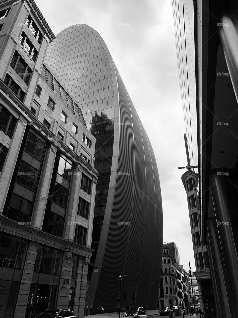 Oval-shaped crystal skyscraper stands out against London sky in the Aldgate district