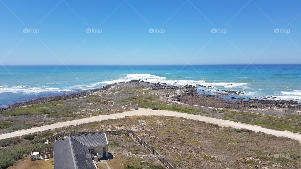 Cape Agulhas the most southern point of the African continent on a clear summer day