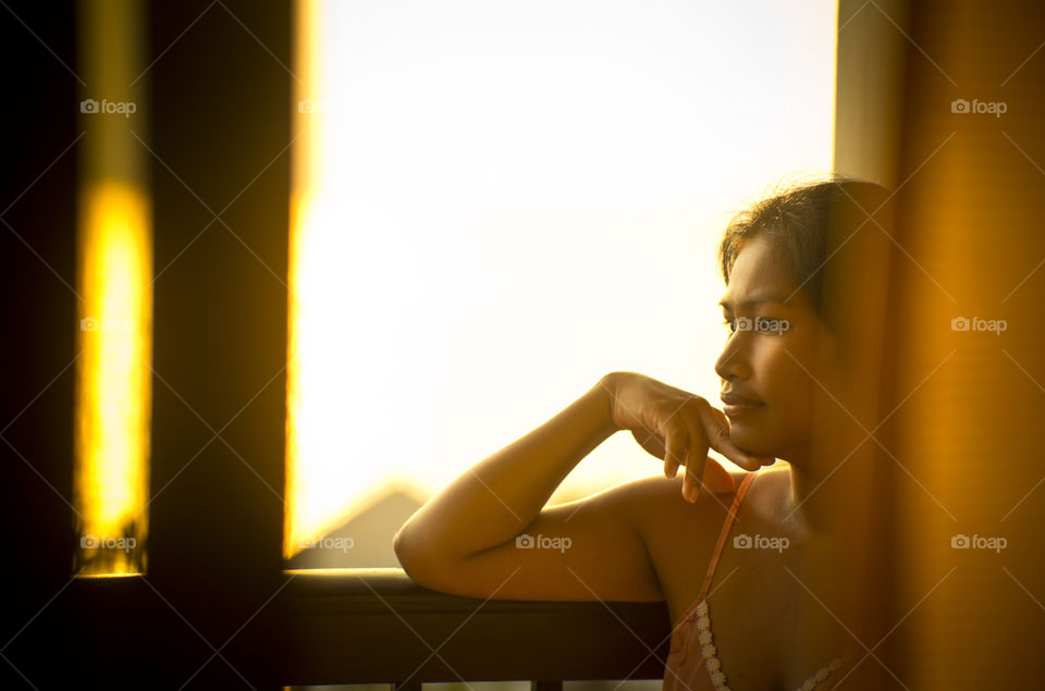 Good morning. lady on the balcony at sunrise