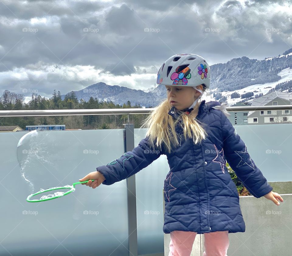 soap bubbles, the girl blows big soap bubbles