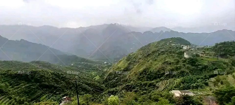 Glory be to God, the magnificent and picturesque view and the natural green trees are a view that is nothing more wonderful than it